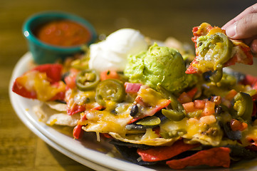 Image showing Nachos with cheese and guacamole