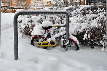 Image showing Children's bicycle in the snow.