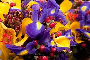 Image showing bouquet with violet irises and yellow callas