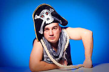 Image showing pirate with a cocked hat and a rope on blue