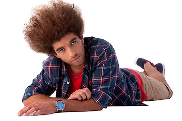 Image showing young man lying, isolated on white