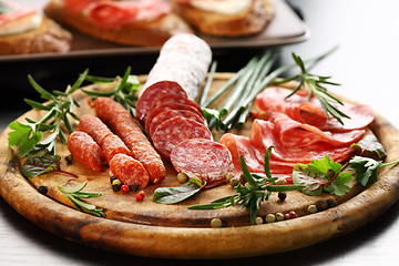 Image showing Italian ham and salami with herbs