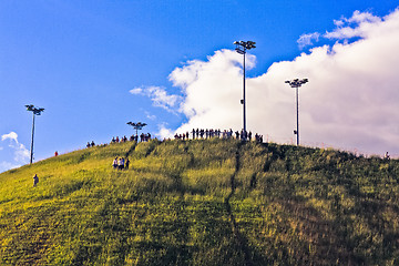 Image showing people on top of a hill