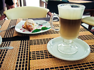 Image showing Breakfast with coffee latte macchiato and croissants