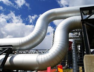 Image showing Industrial zone, Steel pipelines and valves against blue sky