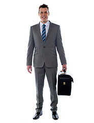 Image showing Business executive holding briefcase