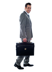 Image showing Going business man holding briefcase