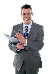 Image showing Businessman with clipboard