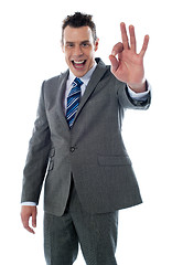 Image showing Handsome corporate man gesturing excellent