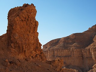 Image showing Scenic pillar rock in a stone desert at sunset