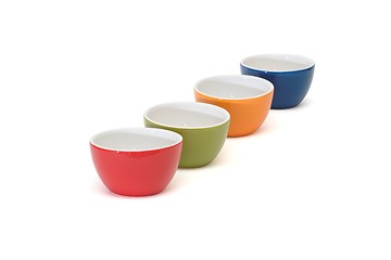 Image showing Diagonal row of four porcelain bowls isolated