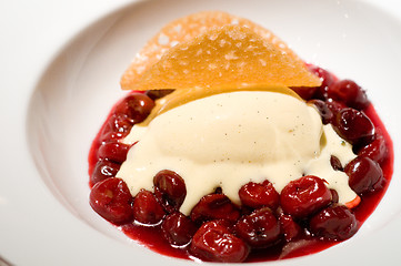 Image showing Warm cherries with vanilla ice cream