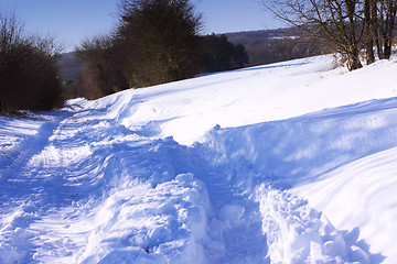 Image showing snowy road in the winter sun in France