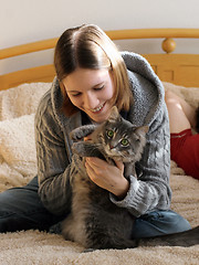 Image showing Girl with a kitten