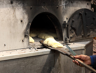 Image showing bread has been baked in an oven on a wooden pallet