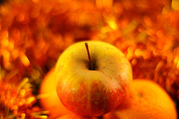 Image showing apple close-up on a background of twinkling garlands