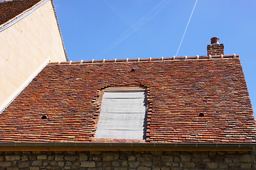 Image showing renovation of a tiled roof of an old house