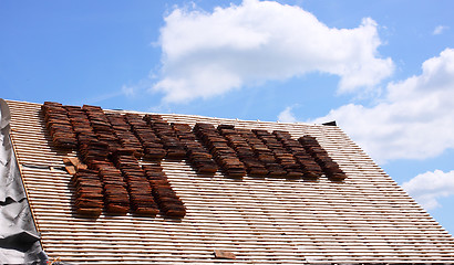 Image showing renovation of a tiled roof of an old house