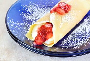 Image showing Delicious Strawberry and Cheese Crepe garnished with confectione