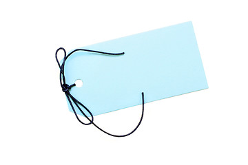 Image showing Blank blue tag with dark blue cord on white with copy space.