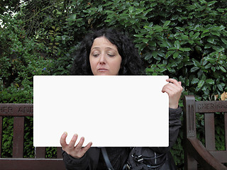 Image showing Girl holding banner