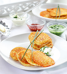 Image showing Potato pancakes with three dips