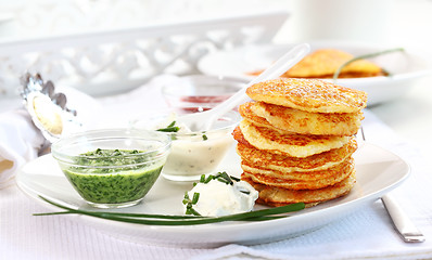 Image showing Potato pancakes with three dips