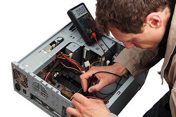 Image showing Professinal repairing a PC