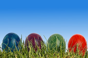 Image showing Four easter eggs in a meadow