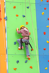 Image showing Child climbing on a climbing wall, outdoor