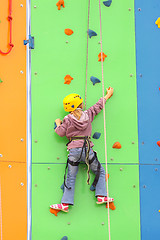 Image showing Child climbing on a climbing wall, outdoor