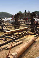 Image showing old machine to saw the logs of wood in France
