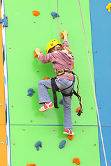 Image showing Child climbing on a climbing wall, outdoor