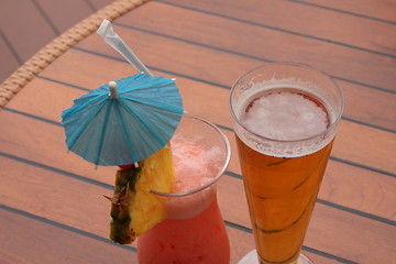 Image showing glass of fruit cocktail and a glass of beer