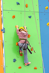 Image showing Child climbing on a climbing wall, outdoor