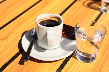 Image showing cups of coffee with a glass of water