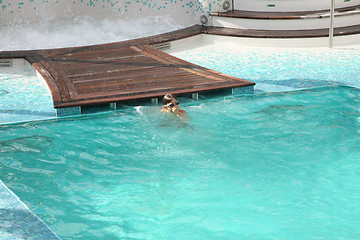 Image showing children swimming in a pool with a diving mask