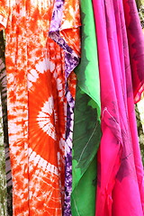 Image showing African dresses colored on a market for the sale