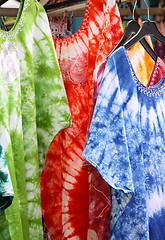 Image showing African dresses colored on a market for the sale