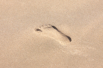 Image showing trace of a child's foot on the sand of the beach