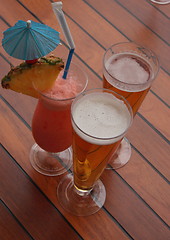 Image showing glass of fruit cocktail and a glass of beer