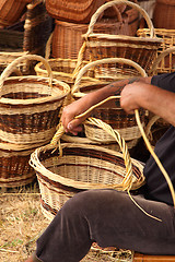 Image showing Details of the manufacturing of wicker baskets by a man