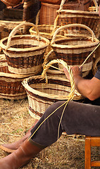 Image showing Details of the manufacturing of wicker baskets by a man