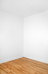 Image showing Empty corner of a room with wooden floor