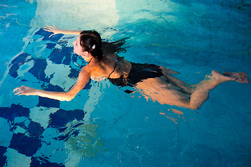 Image showing Attractive girl in swimming pool