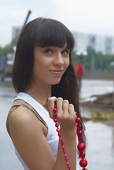 Image showing Girl with red beads