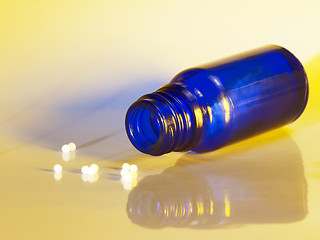 Image showing small bottle and globules