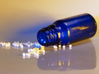 Image showing small bottle and globules