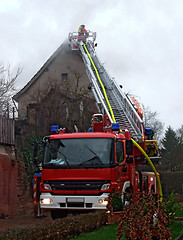 Image showing fireman on ladder