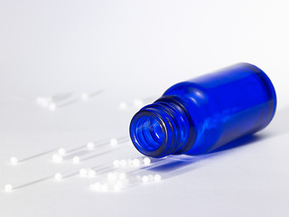Image showing small bottle and globules